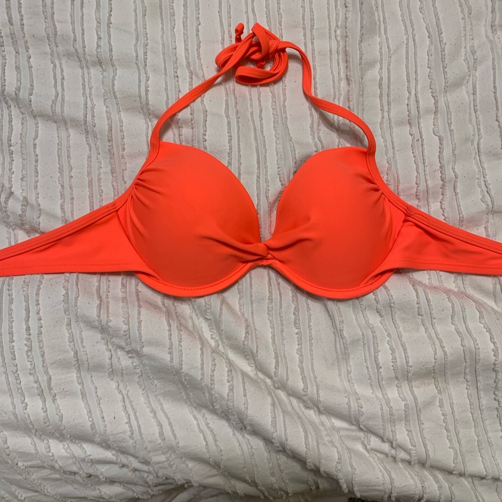 A bright peach bikini top